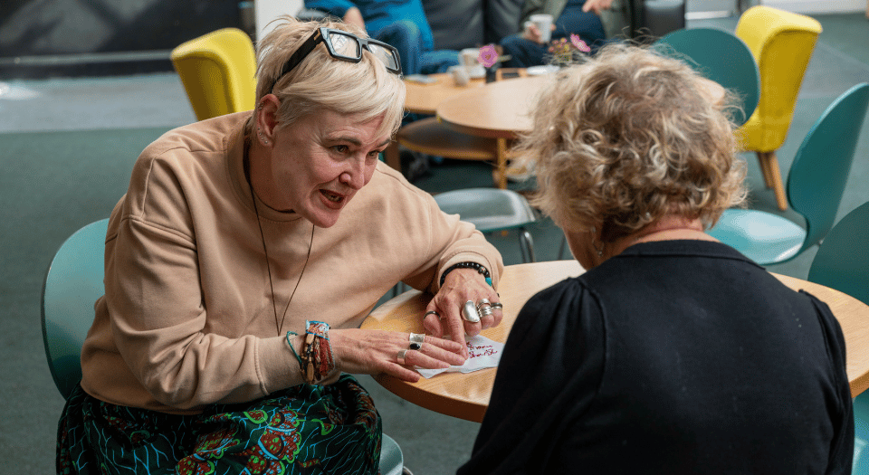 Threads of Freedom - at The Spring 2025 - Helen, lead artist with member of the public